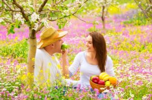 Couple snacking outdoors